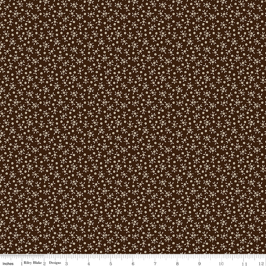 Worth Repeating Ditsy Coffee by Riley Blake - tiny cream five-petal blossoms and leaf sprigs on coffee brown cotton fabric